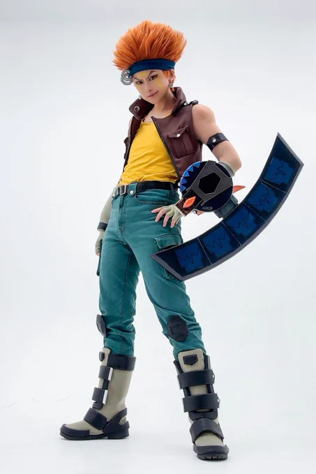 Yu-Gi-Oh! 5D’s Crow Hogan cosplay with a handmade Duel Disk shown in three different forms.