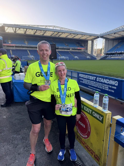 Kelly and Mike with medals after the race