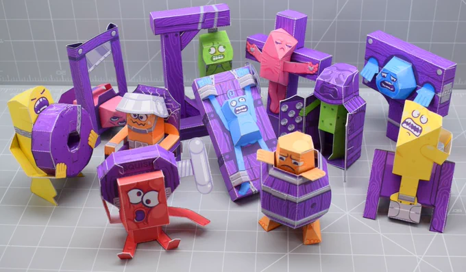 A photo of a collection of 11 papercrafts, each depicting a different medieval instrument of destruction and demise. 