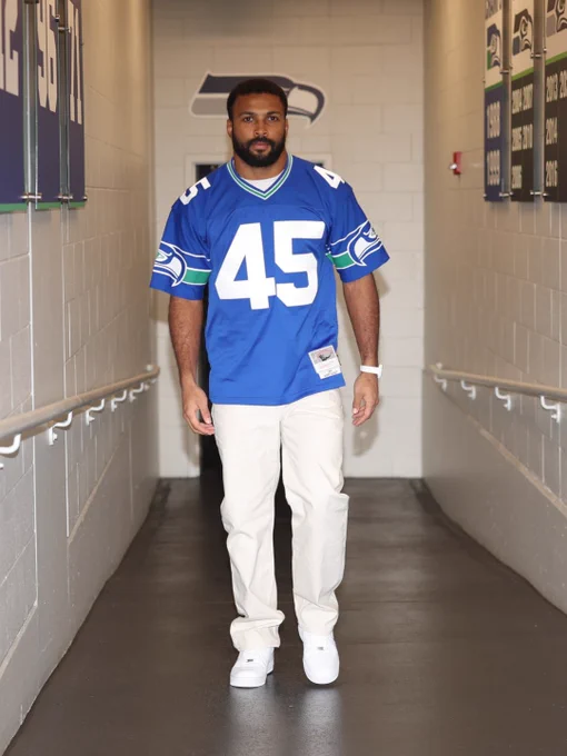 Julian Love wearing Kenny Easley jersey