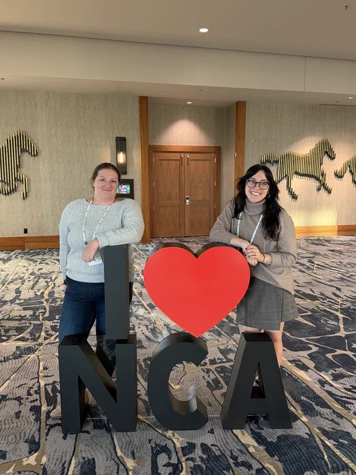 Caley Hewitt (left) and Morgan Badurak posed with a sculpture that reads “I ♥️ NCA”