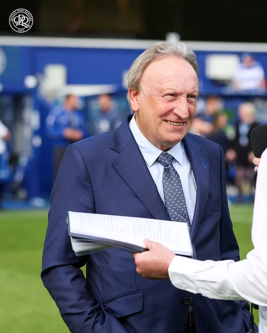 Neil Warnock on the pitch at MATRADE Loftus Road.