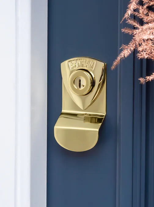 Banham Polished Brass security locks in a Banham security blue door in London. Security, elegance and craftsmanship. 
