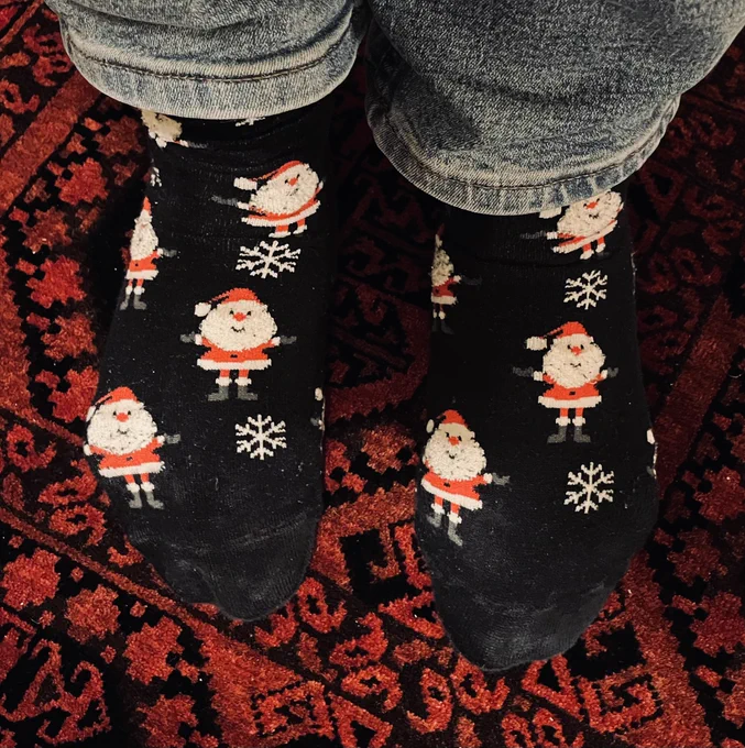 Black socks with little Santas & white snow flakes.
