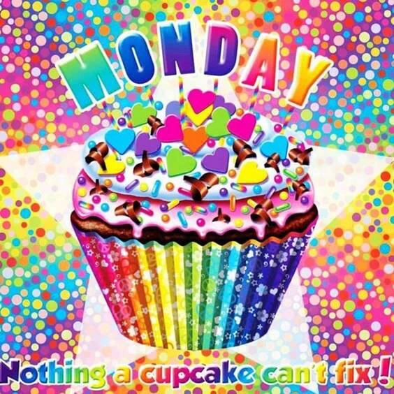 A brightly colored, rainbow-themed cupcake with purple frosting, heart-shaped sprinkles, and chocolate curls sits in the center of a vibrant, multicolored dotted background. Above it, large rainbow letters spell “MONDAY,” and below, the text reads, “Nothing a cupcake can’t fix!”
