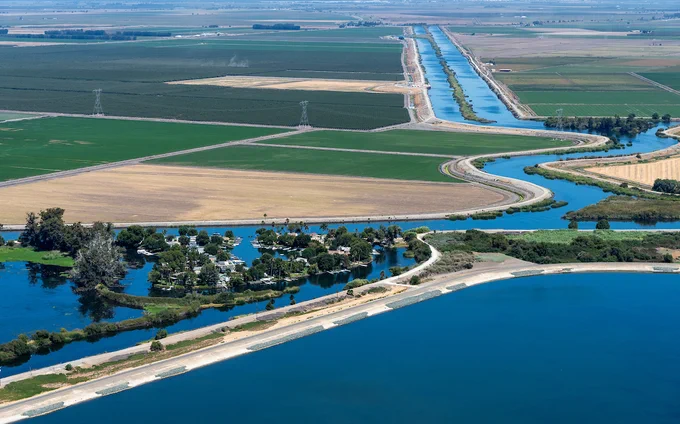 An aerial view shows the two canals, North and Victoria, located in San Joaquin County, California, with part of the State Water Project Clifton Court Forebay located in Contra Costa County, pictured in the foreground. The SWP facility is a shallow reservoir at the head of the California Aqueduct and provides storage and regulation of water flows into the Banks Pumping Plant. Photo taken August 28, 2025. 


