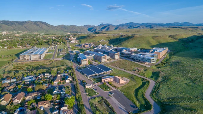 National Laboratory of the Rockies campus with mountains in the background. 