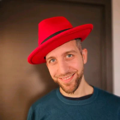me, wearing a red fedora