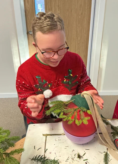 student making a christmas bauble decoration