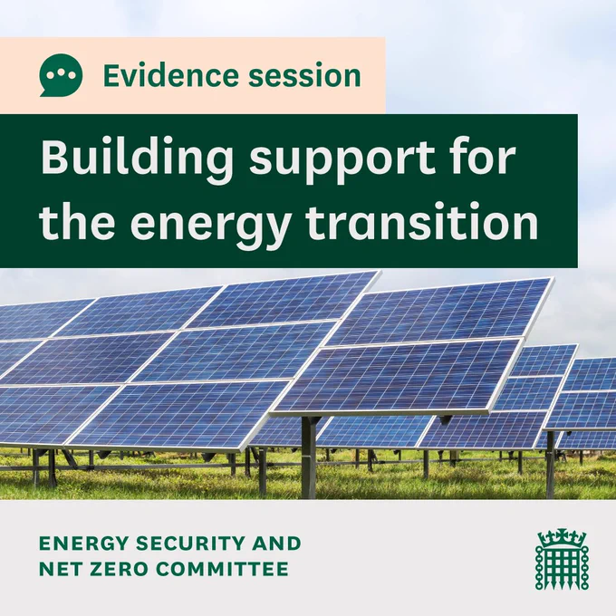 Evidence session.
Building support for the energy transition.
Energy Security and Net Zero Committee.
Photo in the background shows a solar farm, a field full of solar panels.