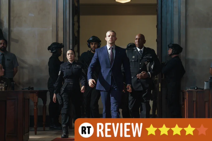 Sergeant Hana Chakri (Francesca Corney), Barclay (Russell Tovey) & General Pierce (Colin McFarlane) marching into the Empress Hall in The War Between the Land and the Sea. A Radio Times review graphic has four out of five stars filled in.