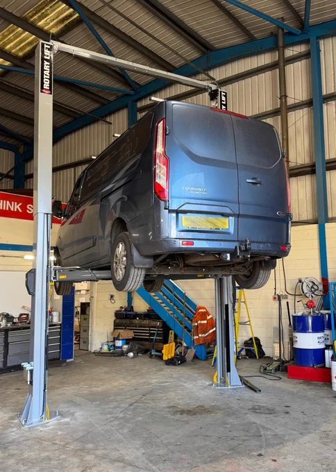 Rotary SPO55M-EH4 2 post vehicle lift with van on