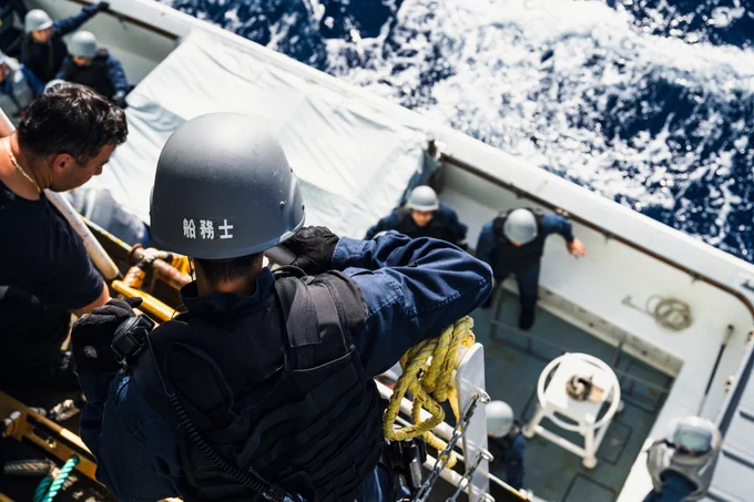 Members of Japenese Ship (JS) TERUZUKI board His Majesty's Canadian Ship MAX BERNAYS during a Maritime Intradiction Operations Exercise as part of ANNUALEX at sea on 21 October 2025. 

Photo Credit: Sailor 1st Class Jordan Schilstra, Canadian Armed Forces Photo
