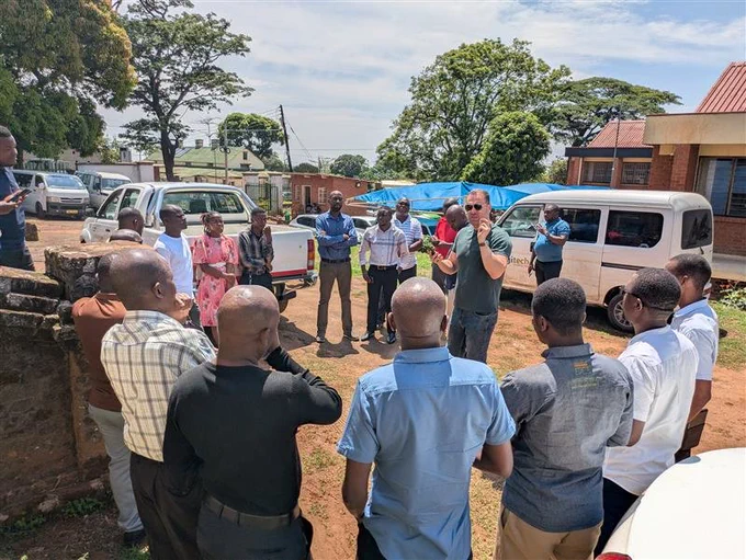 Photo of Dr Sarchil Qader guides Malawi NSO statisticians on ground data collection. 