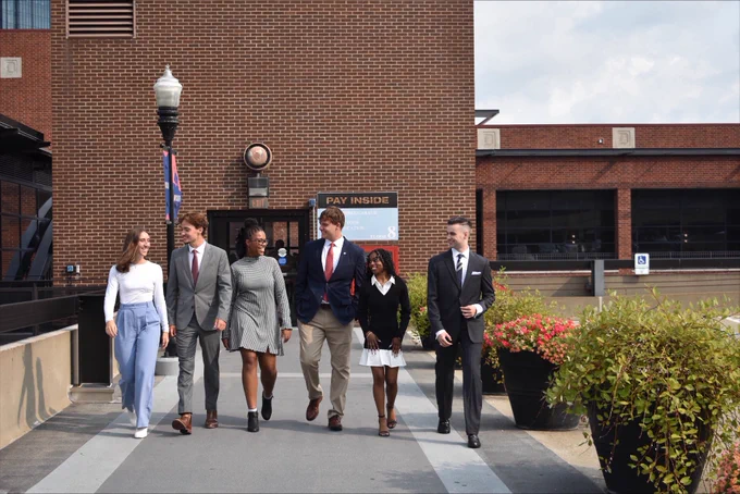 Nick Miller walks with Student Government Association peers.
