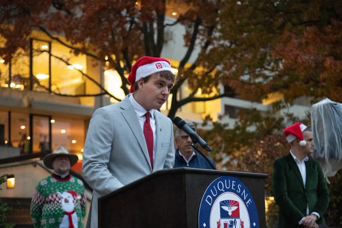 Nick Miller gives a speech on Academic Walk.