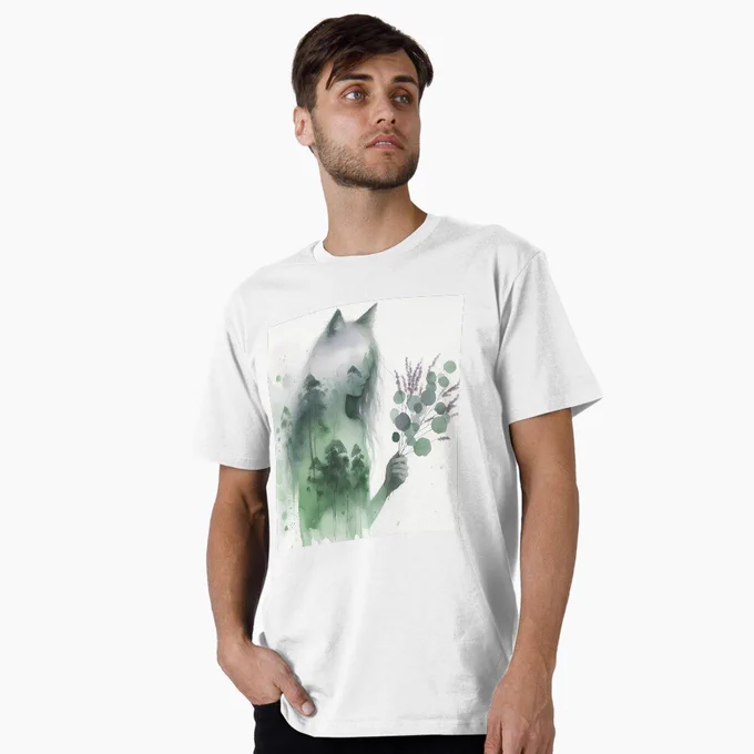 Male model wearing T-shirt with an artsy watercolour painting of a wolf spirit holding gum leaves with a eucalyptus forest superimposed. 
