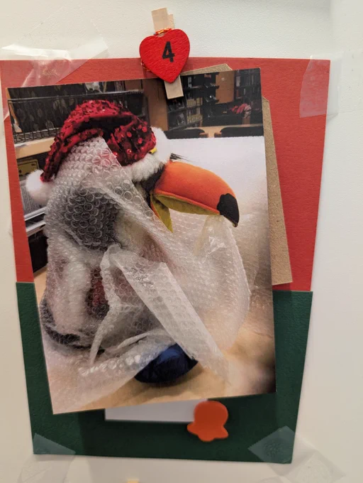 Library Mascot wrapped up in bubble wrap. 
