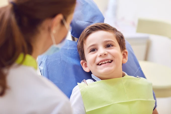 A young boy visits the dentist