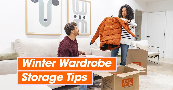 Two individuals packing a winter jacket into a box in a living room, with "Winter Wardrobe Storage Tips" overlayed on the image.