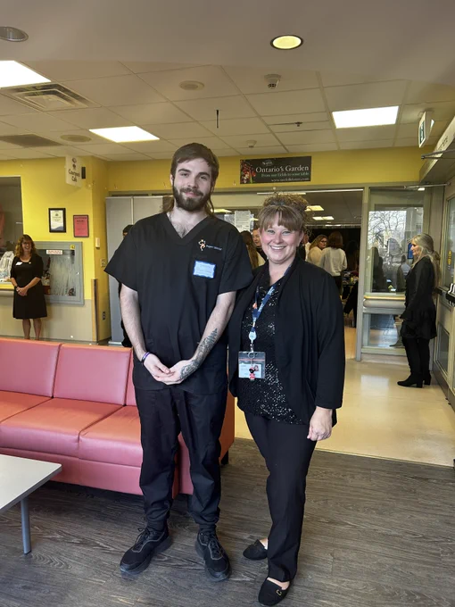 Two people stand together posing for a picture at the Simcoe and District Chamber of Commerce's Creative Workforce Solutions Symposium & Business After 5