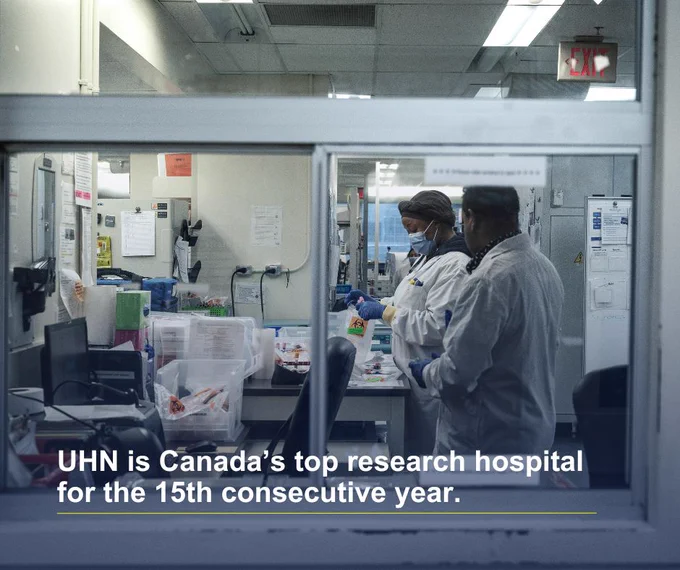 Two UHN health care professionals working in a lab at UHN, Canada's top research hospital for the 15th consecutive year by Research Infosource Inc.