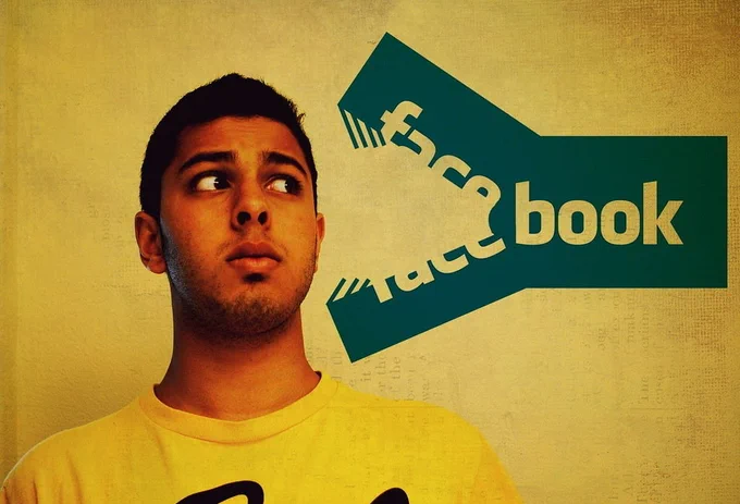 A distressed young man in a yellow shirt looks away from a predatory, sharp-edged graphic of the Facebook logo, visually representing the feeling of being consumed or silenced by social media dependence.