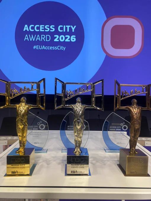 The three awards on a table