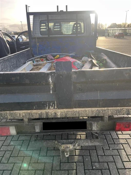 Insecure load in flat bed truck
