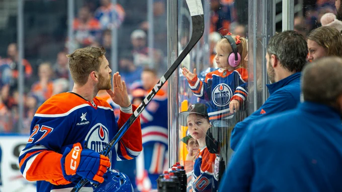 Brett Kulak blowing a kiss to his daughter during warmup at Rogers Place. 