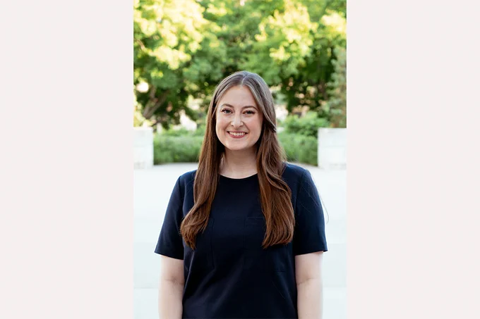 Rebecca Felter in front of green trees