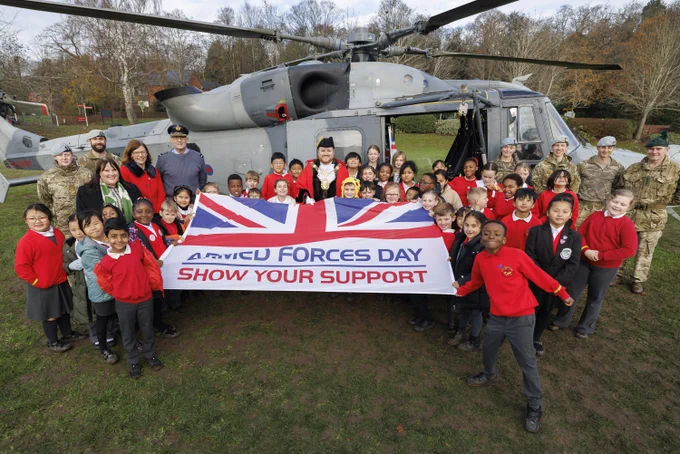 A Royal Navy Wildcat helicopter dropped into an Aldershot playing field to celebrate the area hosting next year's armed forces day event.