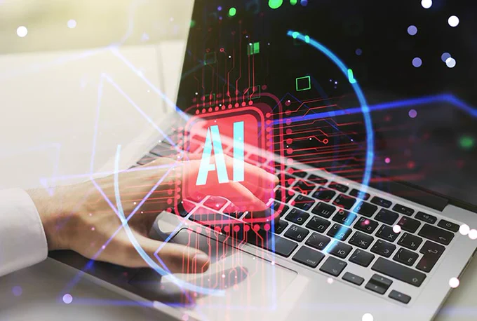 Photo of a person using AI on their laptop