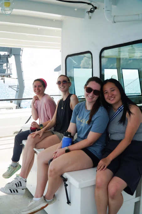 Participants (left to right: Claire Garfield, Eleanor Lawrence, Amanda Ellis, and Emily Hu) of the September 2025 C-CoMP cruise AE2520 sit together on the R/V Atlantic Explorer as they wait to disembark from Bermuda for the cruise! Photo by Fadime Stemmer. 