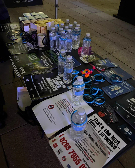 Table display at welfare pop up including water, posters, leaflets and sanitary products