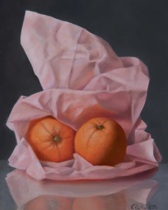 A realistic painting of two oranges nestled inside pink tissue paper against a dark background. Artwork by Kelly Birkenruth using oil on panel. Posted by Abend Gallery in Denver, Colorado, USA.