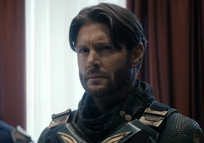 Jensen Ackles as Soldier Boy in The Boys Season 5. He’s wearing his trademark green suit. Hair and beard are on point.