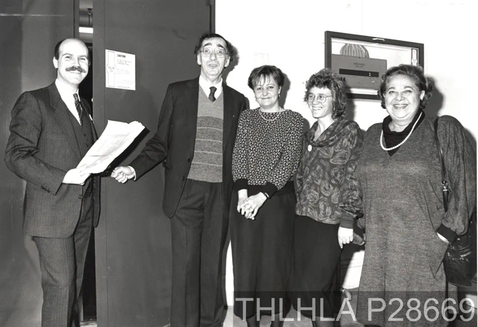 Black and white photo of staff and guests at the opening of the archive strong room in 1988.
