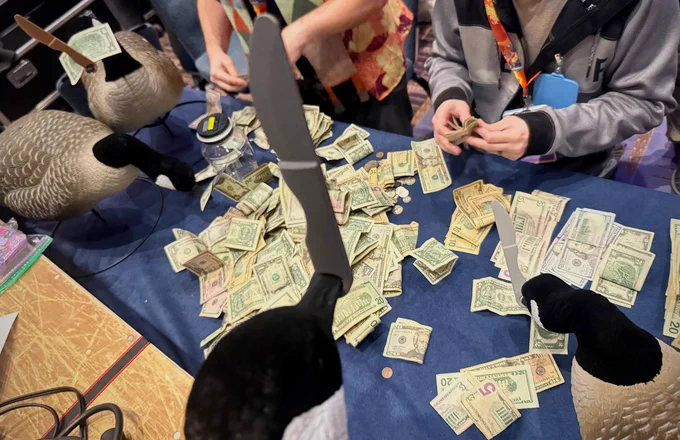 Several geese with knives supervising the final charity count 