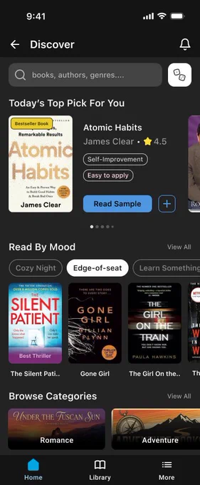 Kindle Discover tab redesign. Dark UI with a search bar at the top, a “Today’s Top Pick For You” hero card showing the book Atomic Habits with tags and a “Read Sample” button, a “Read By Mood” chip row with “Edge-of-seat” selected, a horizontal carousel of thriller book covers, and visual cards for Romance and Adventure categories at the bottom.