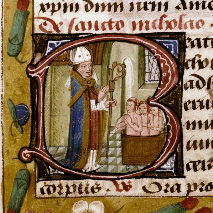 A manuscript depicting St Nicholas standing over a tub with three young boys inside who he has resurrected, set within the letter B on a page. 