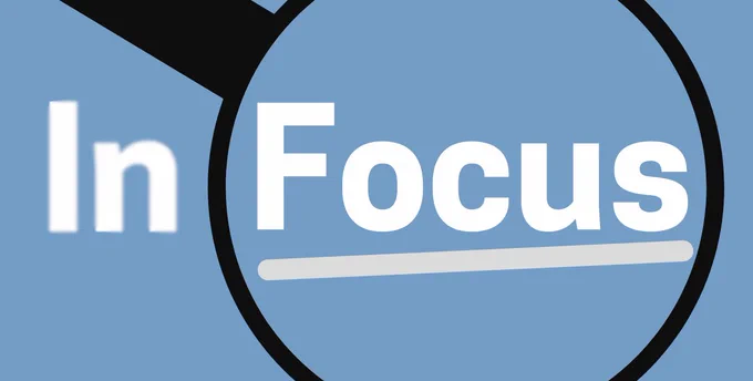 The words 'In Focus' with a magnifying glass.