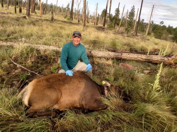 James Cain poses with a tagged ungulate. James's research interests are primarily in wildlife-habitat relationships, population ecology, and the influence of management practices on native wildlife species. 