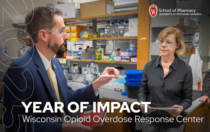 Two individuals, one holding a scientific sample, discussing in a lab with text overlays mentioning "Year of Impact" and "Wisconsin Opioid Overdose Response Center" at the University of Wisconsin School of Pharmacy.