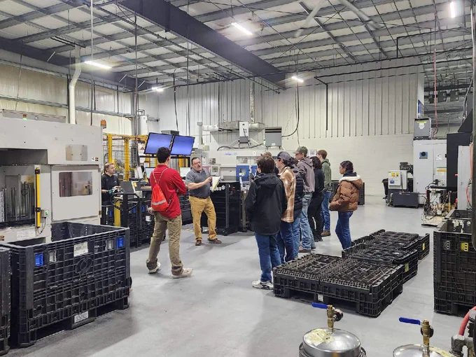 Student Tour CNC Machine Shop Clutch Housing Robot Area