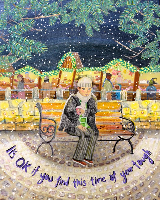Photo of a person sitting on bench wrapped up in winter clothes, behind them is a festive winter market. The person's face looks a little worried and down. There's text that says 'It's OK if you find this time of year tough' 