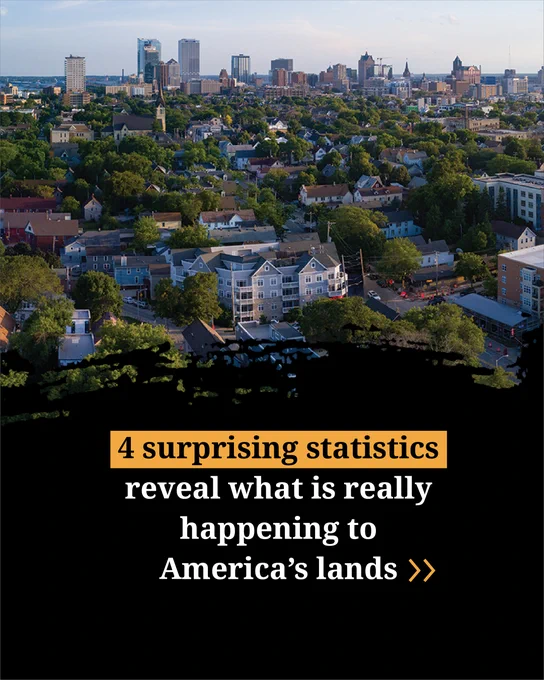 Arial view of a city skyline with various buildings and trees, overlaid with text that reads '4 surprising statistics reveal what is really happening to America's lands'.