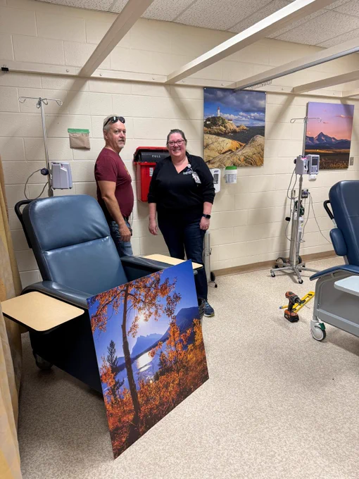 Don Tannahill of the ArtWorks for Cancer team and Krista Lovering of the Orillia Soldiers' Memorial Hospital (OSMH) discuss how several Sherman Hines photographs will be installed in the chemotherapy area.