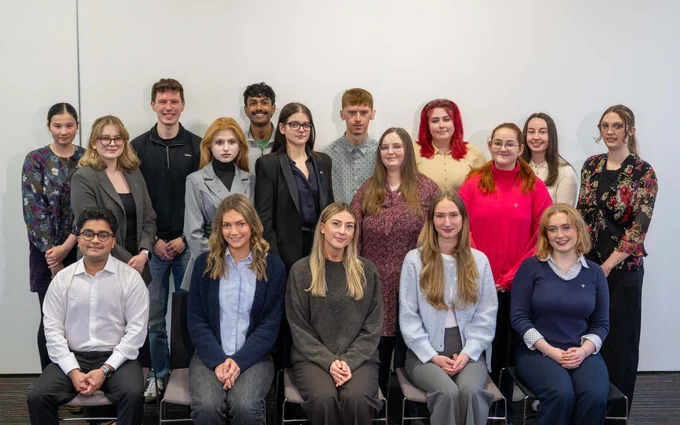 John Smith Centre 2026 Parliamentary Interns posing for a group photo. They are in three rows, with one row seated at the front and the other two standing behind.