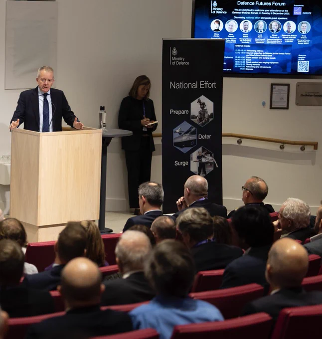 Chief of the Defence Staff presenting to audience members.